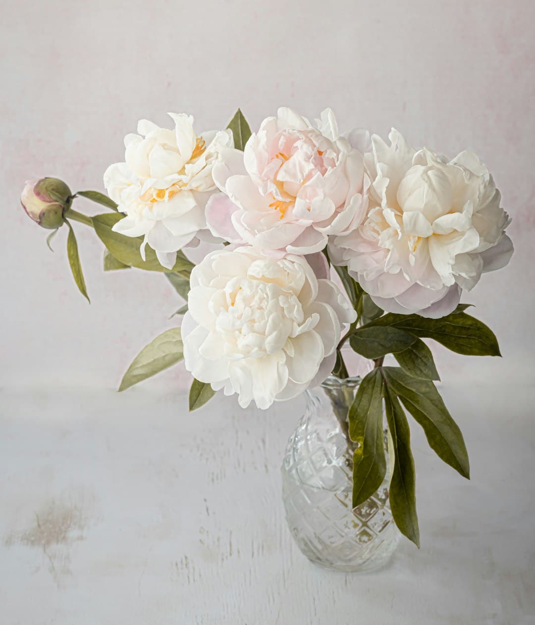 A vase of white flowers