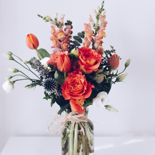 Red flower arrangement on a white table