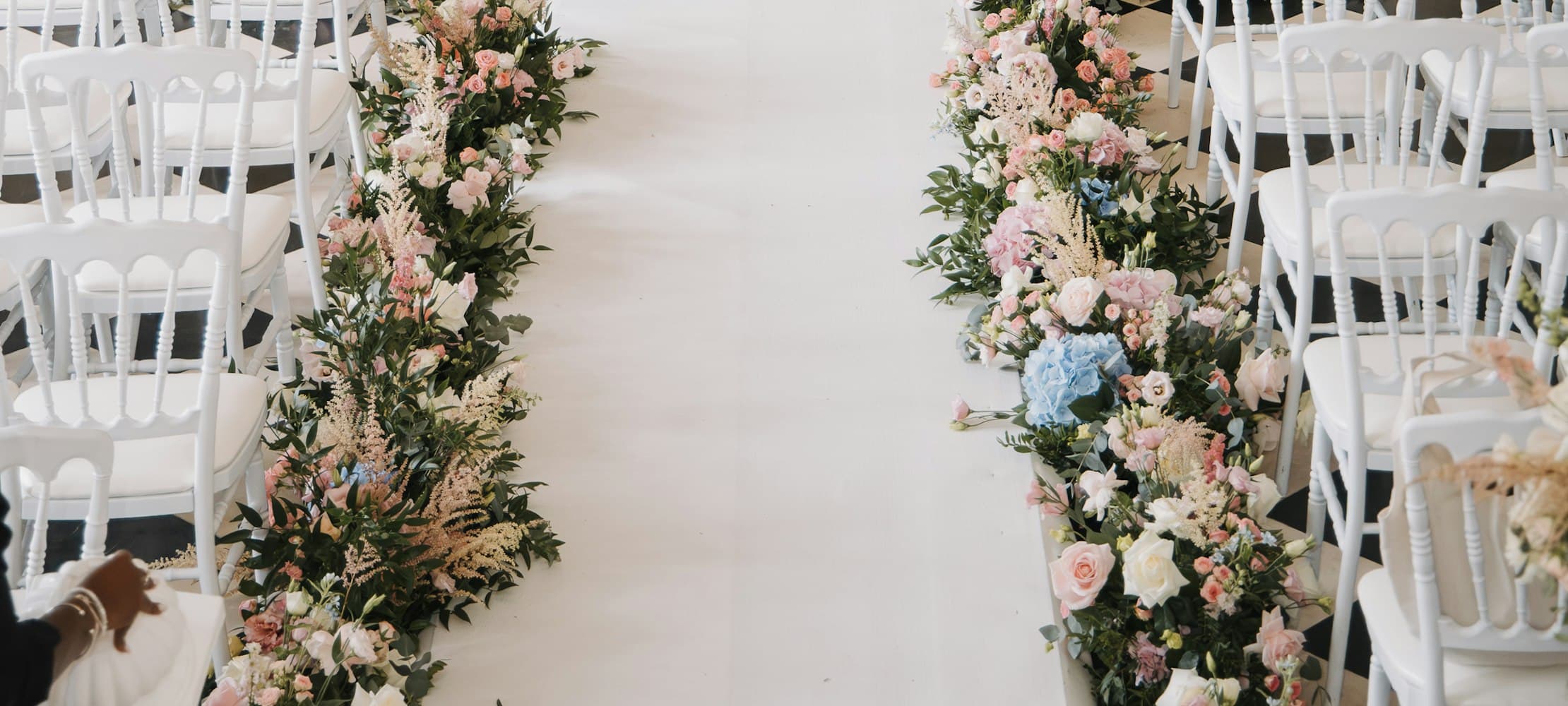 A floral archway set for a ceremony